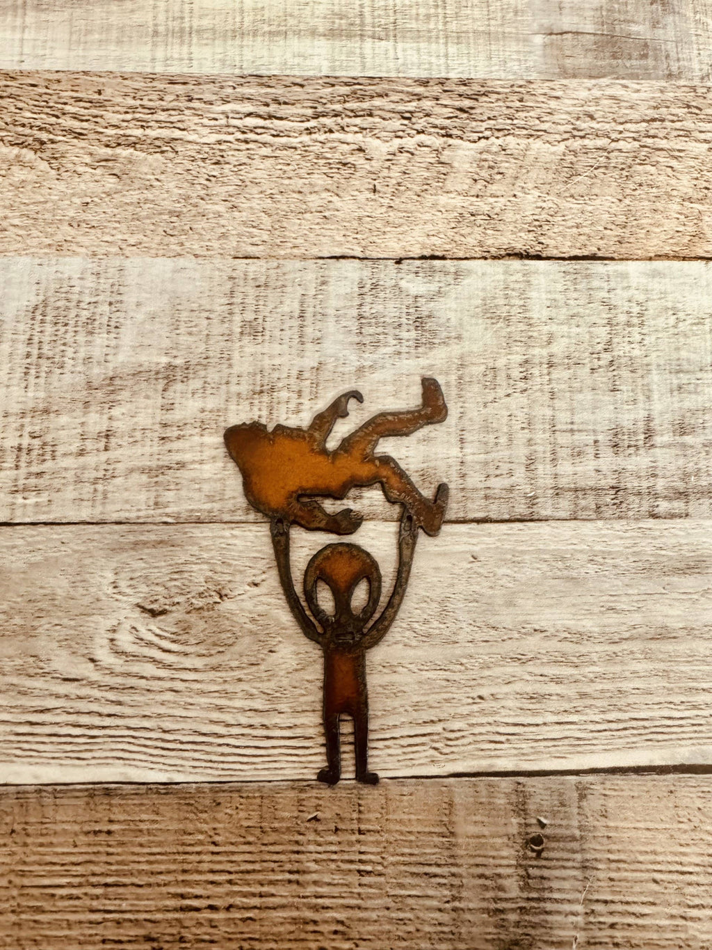 Alien Holding Bigfoot Rustic Metal Magnet Made in USA